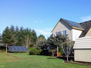 Solar Panels on a home and on the ground