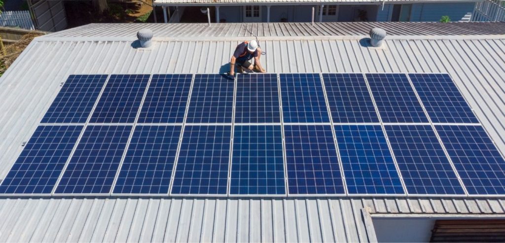 two solar of solar panels being inspected by oregon solar provider