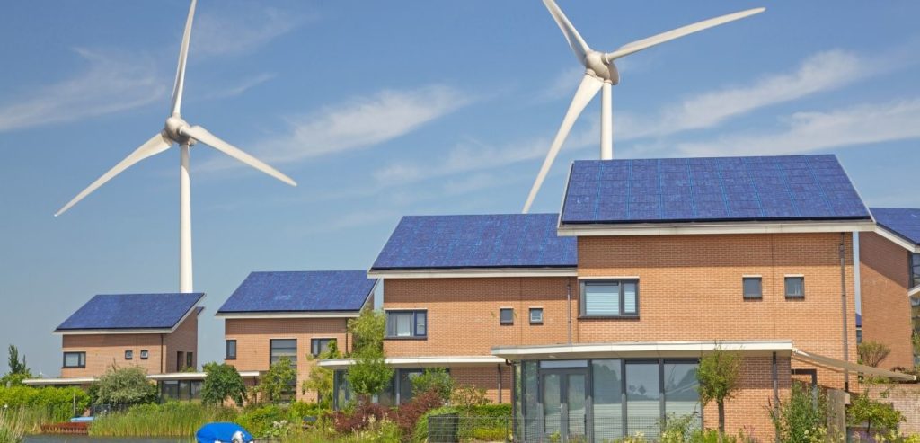 New family homes with solar panels and wind turbines