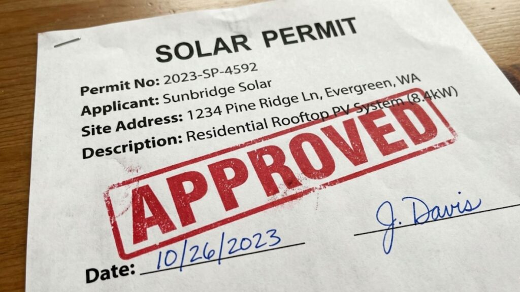 A solar permit document stamped as APPROVED, with the permit number, applicant, site address, system description, date and signature.